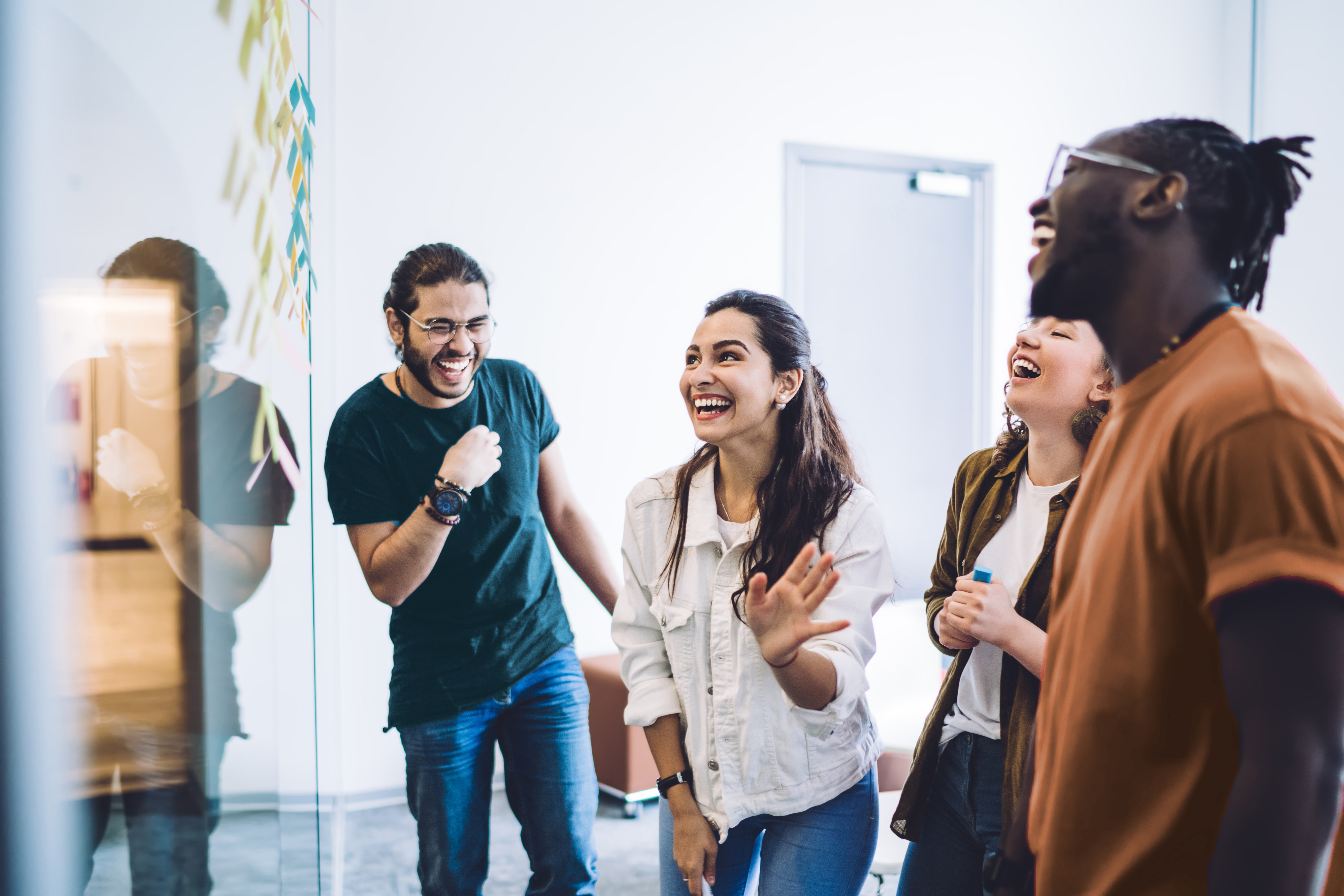 Happy coworkers laughing