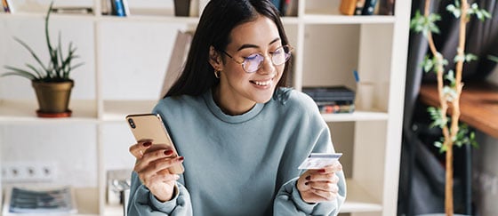 Young woman uses her fixed rate credit card with CCCU.