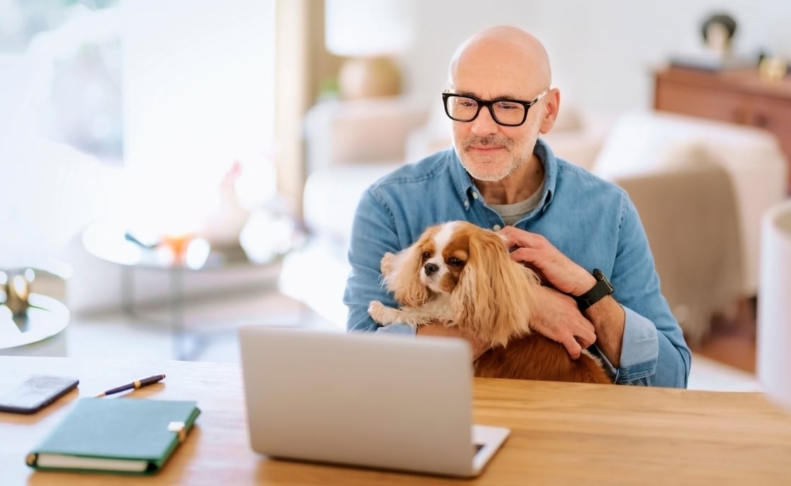 Man watching webinar about social security basics with CCCU wealth management