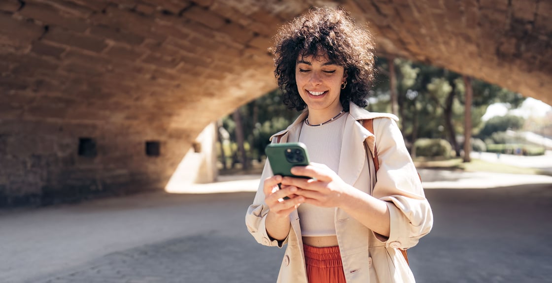 Woman accessing Online Banking on-the-go.