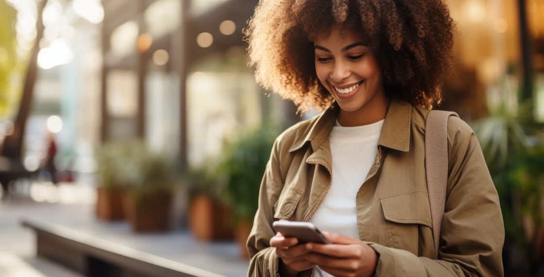 Woman on her smartphone using our new one-time passcodes to authenticate activity.